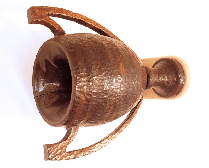 Black Hole Trophy is made of laminated and carved wood and is cantilevered sidew